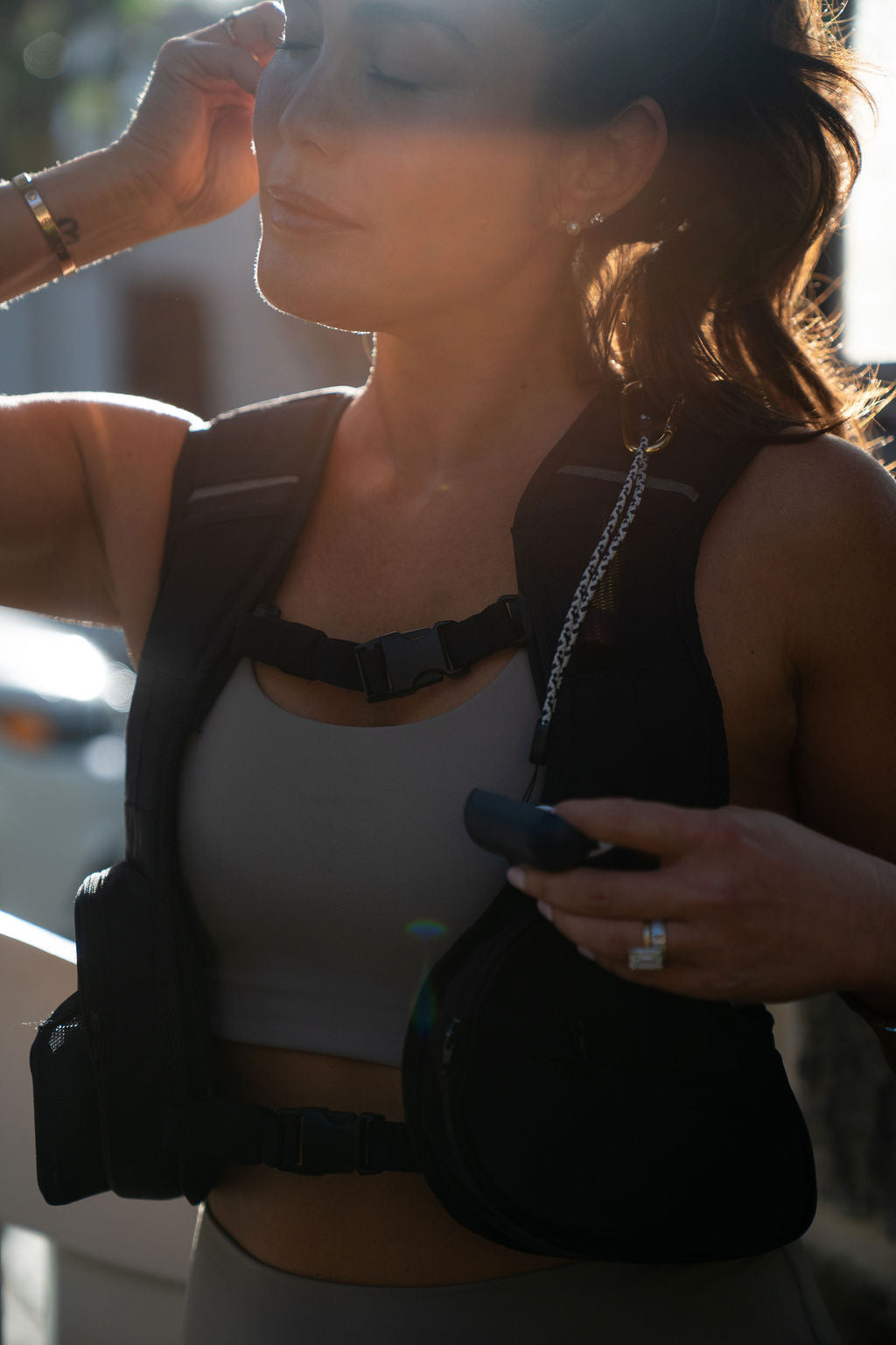 Woman holding a phone with a blurred background